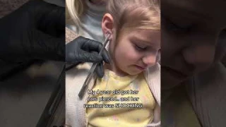 SHOCKING reaction to getting her ears pierced.. #shorts